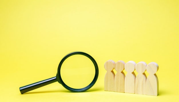 disclaimer: doctor names in this article have been anonymized for reasons regarding confidentiality, team workers magnifying glass search people